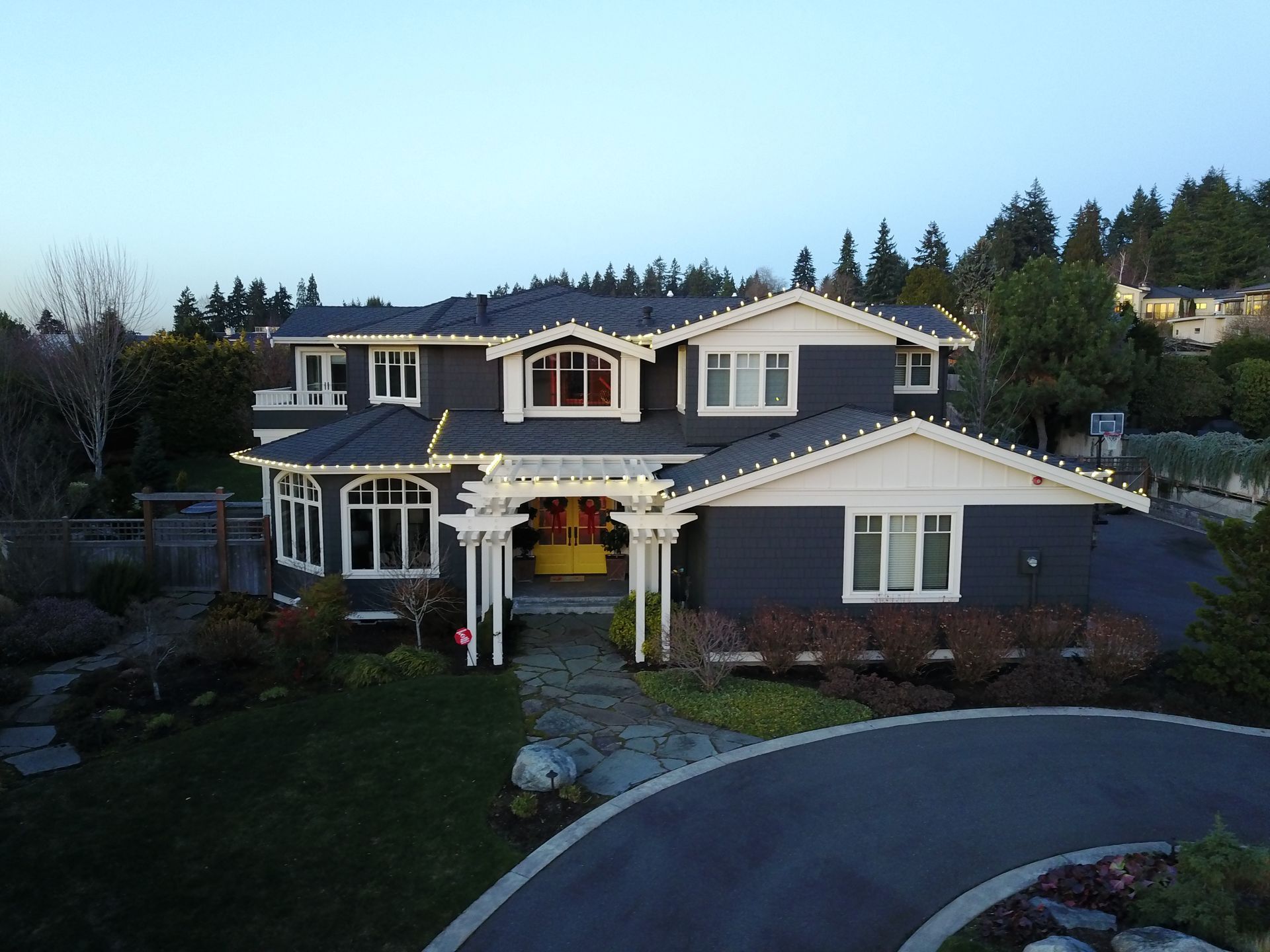 An aerial view of a large house with a lot of windows