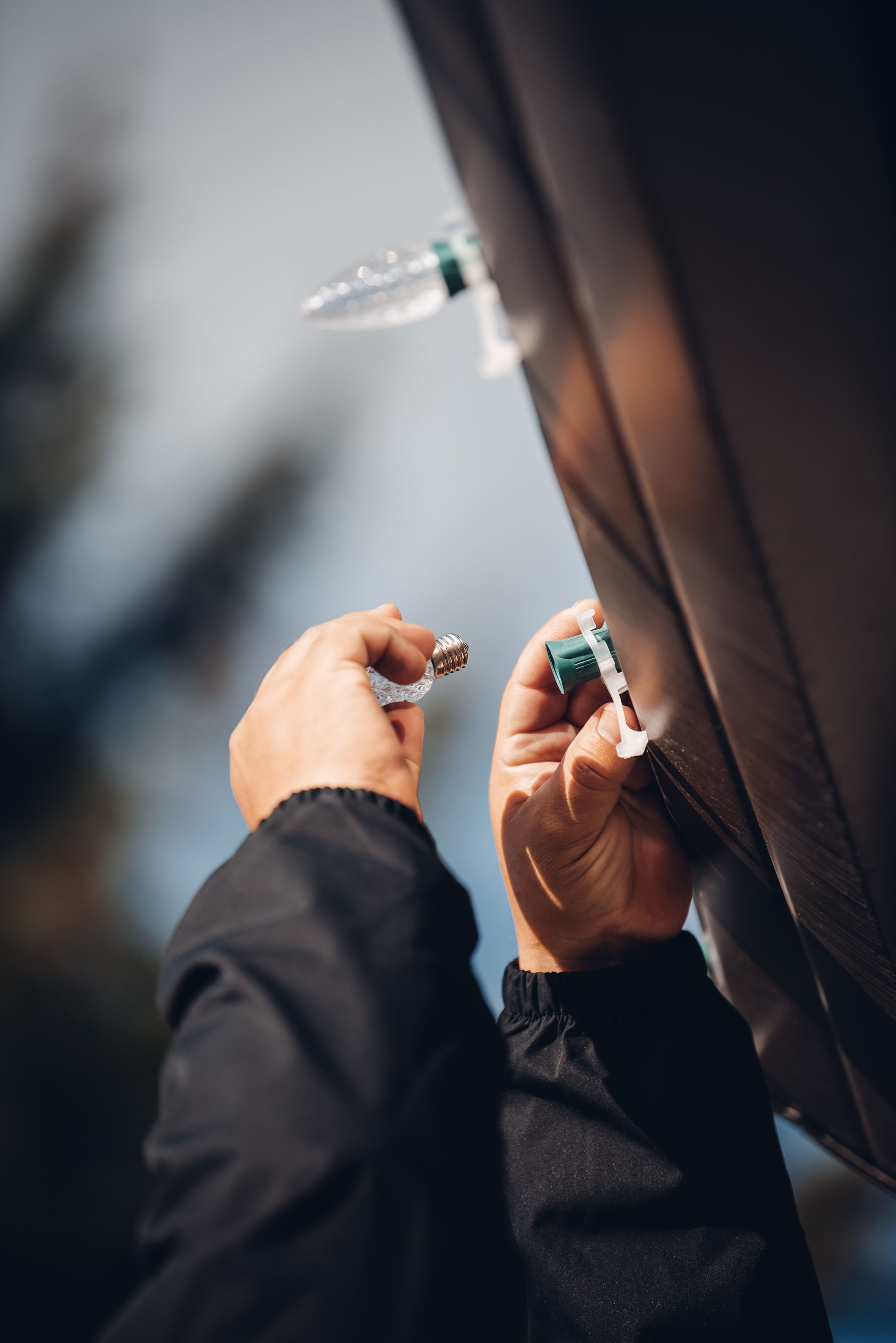 A person is holding a syringe in their hand.