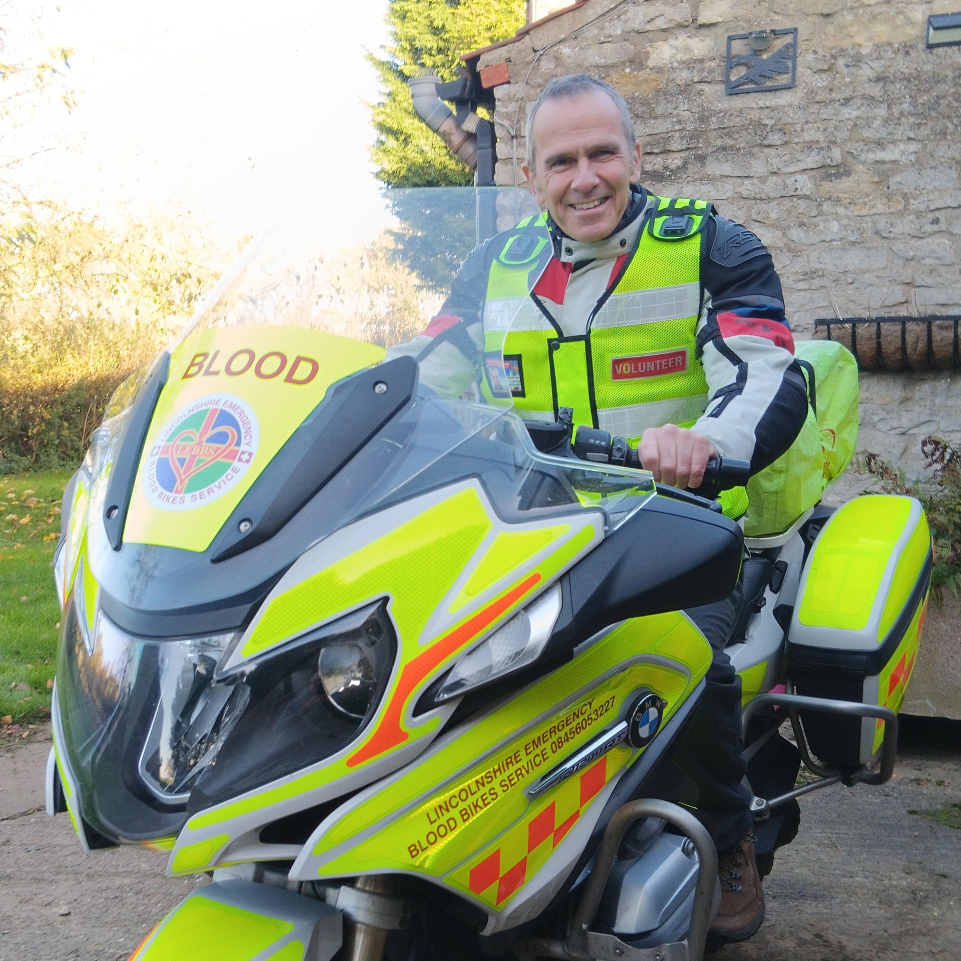 man sitting astride an emergency motorbike