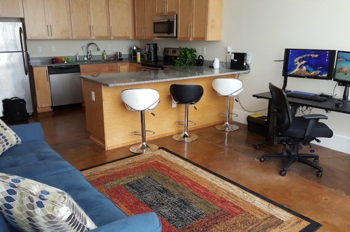 Interior view of kitchen from front living space of 801-803 N 23rd Street with furniture