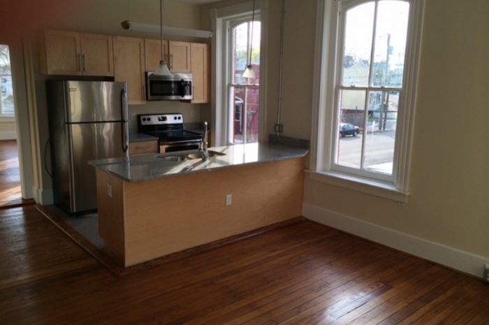 Interior view of kitchen from front living space of 801-803 N 23rd Street