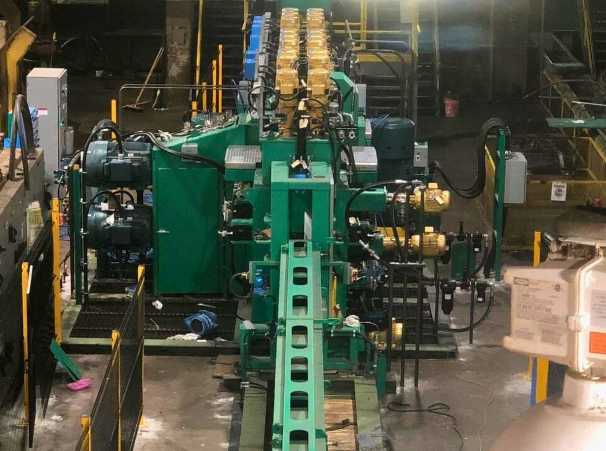 a room filled with lots of red pipes and valves .