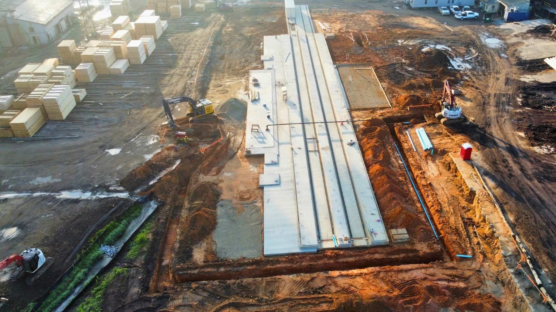 an aerial view of a construction site with a large concrete structure being built .