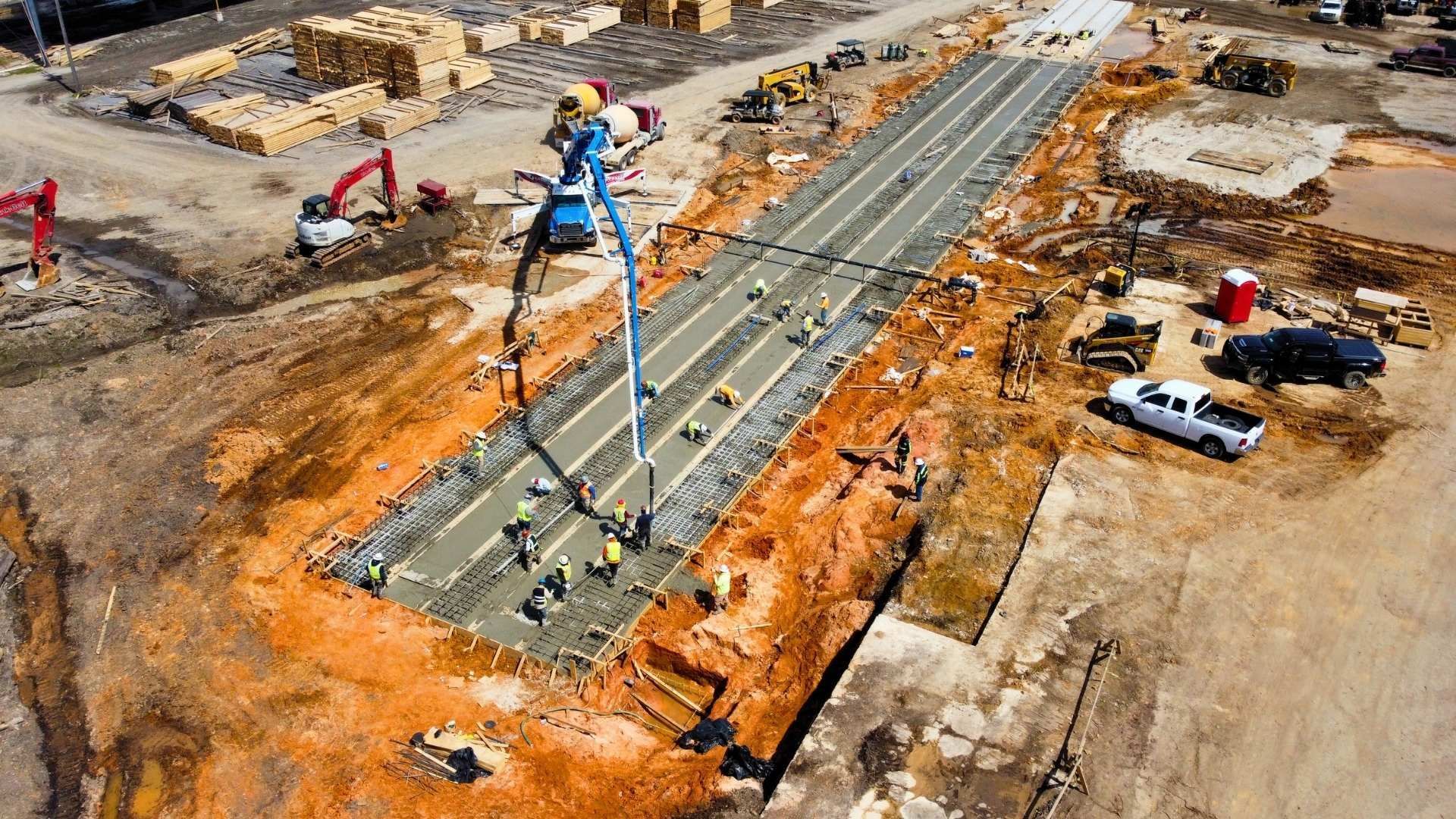an aerial view of a construction site with a road being built .