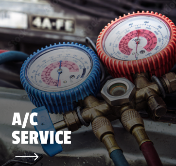 A couple of gauges on a car that says a/c service | DAS Auto Werks