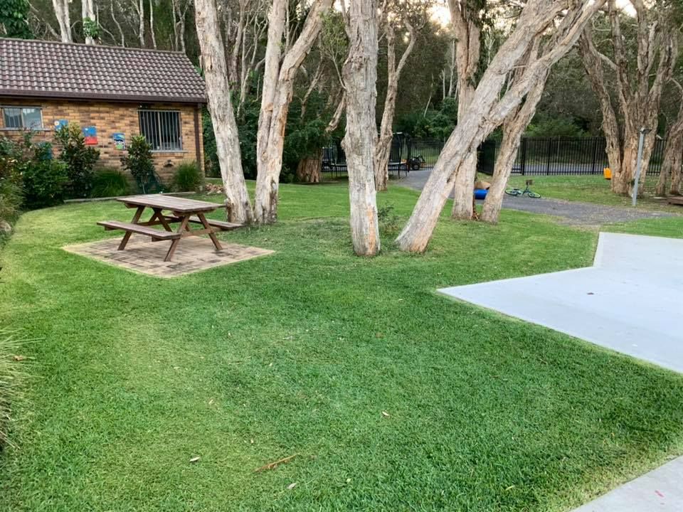 Picnic Table and Trees on Mowed Lawn — All Round Ground Maintenance in Woolgoolga, NSW