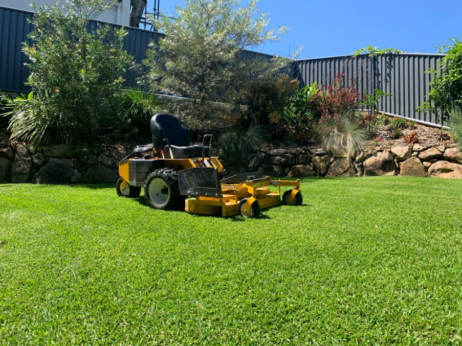 Ride on Mower in Garden — All Round Ground Maintenance in Woolgoolga, NSW