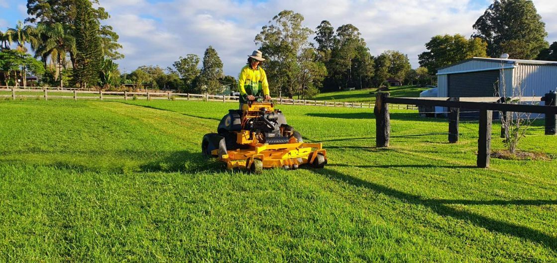 Man on Ride on Mower — All Round Ground Maintenance in Woolgoolga, NSW