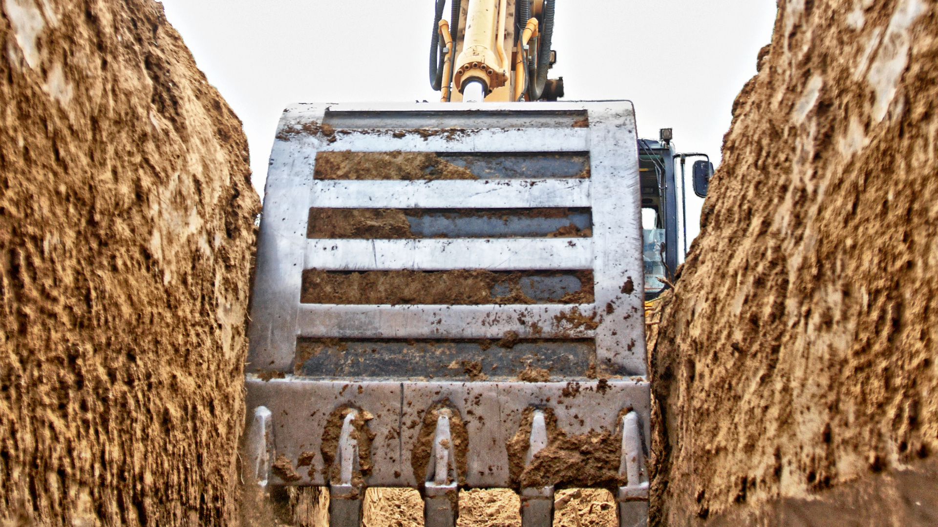 A bulldozer is digging a hole in the ground.
