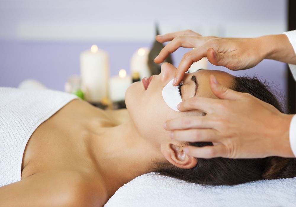 Woman Getting Eye Treatment With Hands Near Her Face — Sage Spa & Beauty in Mackay, QLD