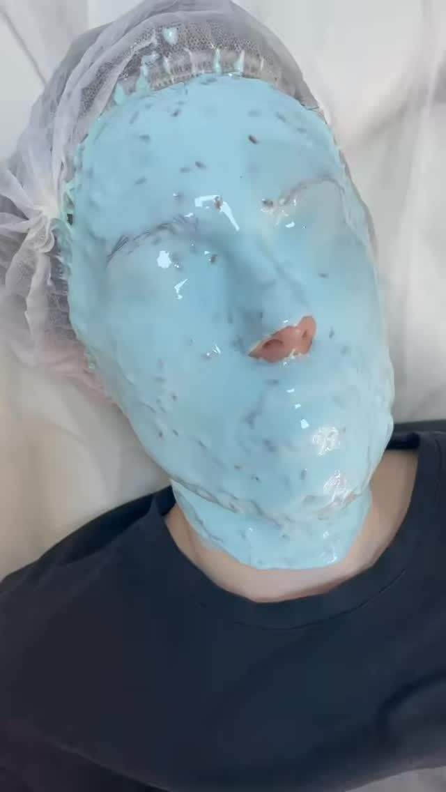 Person Wearing a Blue Facial Mask in a Salon Setting — Sage Spa & Beauty in Mackay, QLD