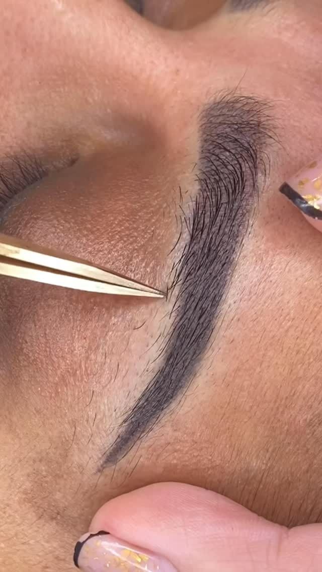 Tweezers Plucking Eyebrow Hairs; Close-up View — Sage Spa & Beauty in Mackay, QLD