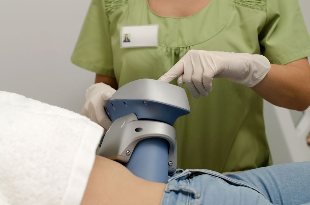 Medical Worker Using a Device on a Patient's Body — Sage Spa & Beauty in Mackay, QLD