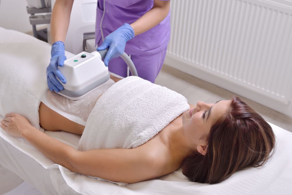 Woman Receiving Fat-freezing Treatment on Her Abdomen — Sage Spa & Beauty in Mackay, QLD