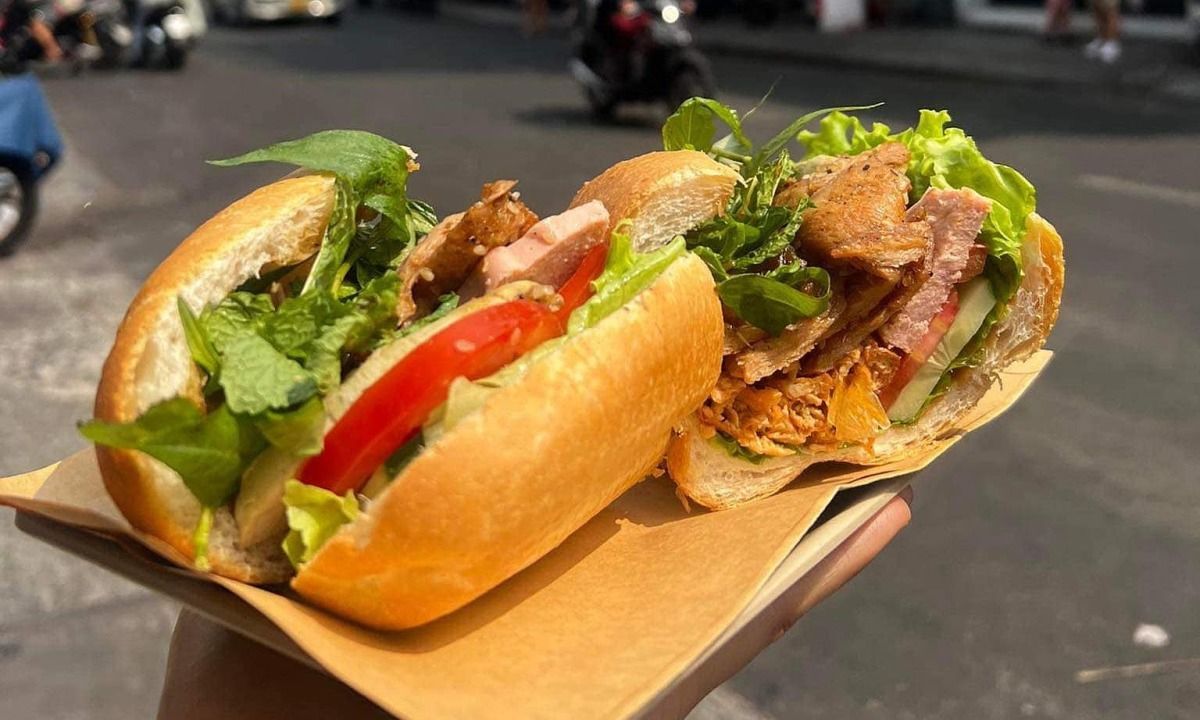 A fresh Vietnamese vegan bánh mì with crispy baguette, tofu, and fresh herbs.