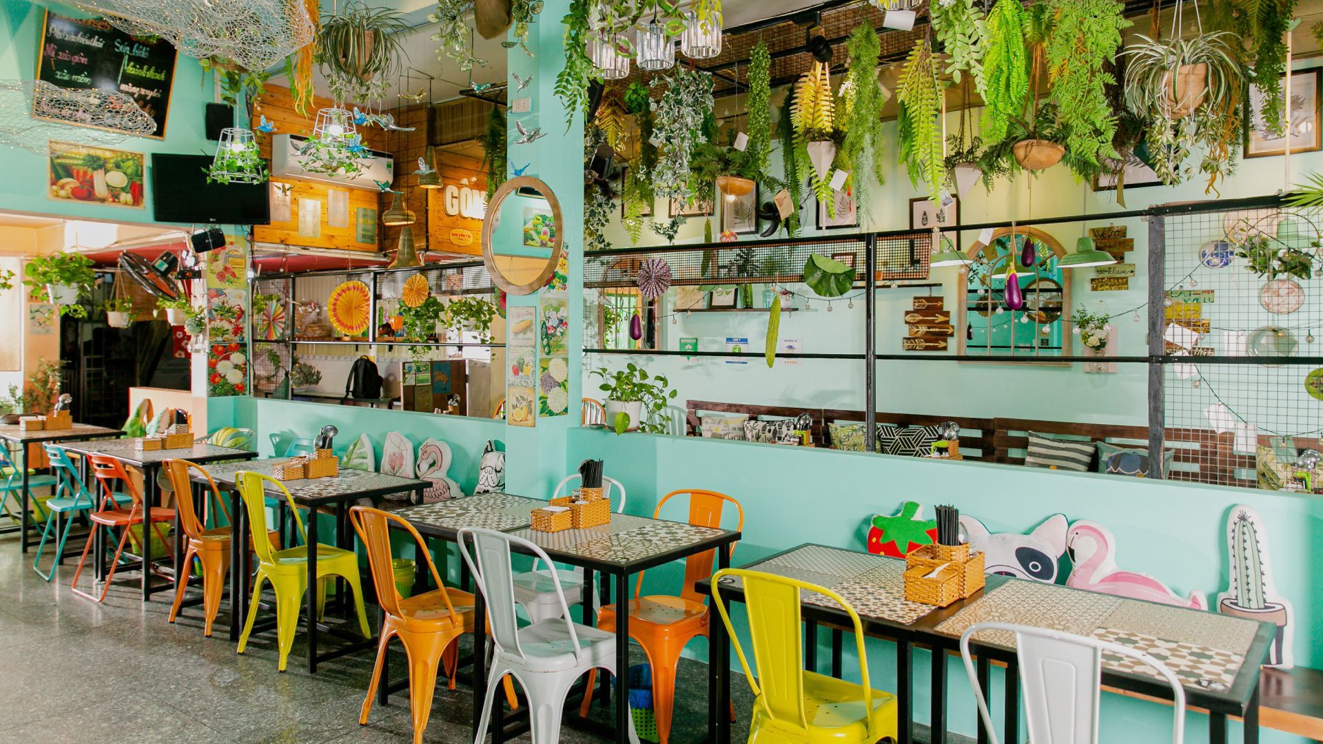 Ans Vegetarian Cuisine in Da Nang, a vibrant plant-based restaurant with colorful decor, lush greenery, and a cozy dining space.