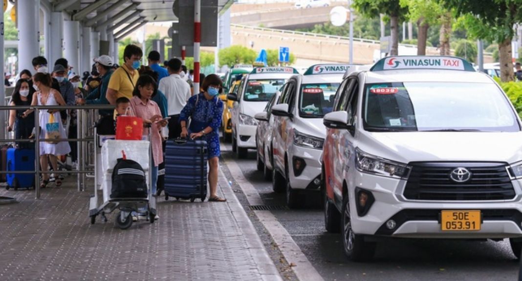 Travelers waiting for taxis at Tan Son Nhat International Airport in Ho Chi Minh City.