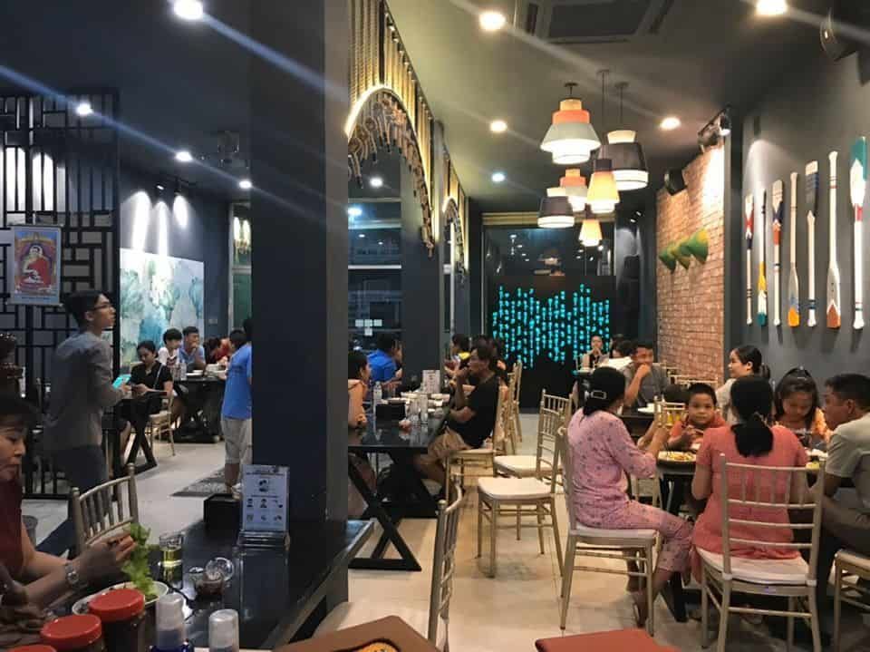 Ngoc Chi Vegetarian Restaurant in Da Nang, a cozy eatery with modern decor, warm lighting, and a lively dining atmosphere.