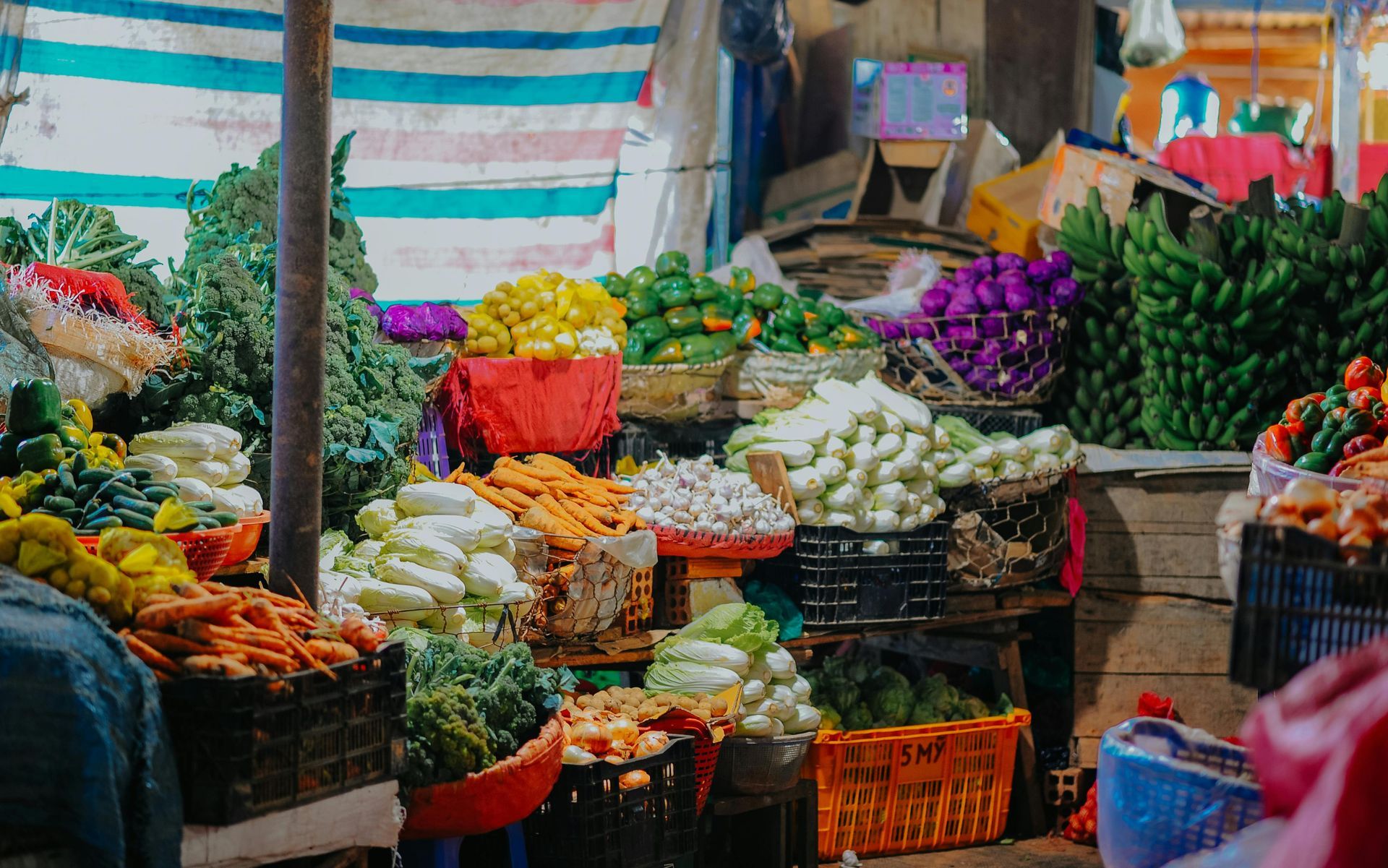 Vibrant market scene showcasing a colorful array of fresh vegetables and fruits