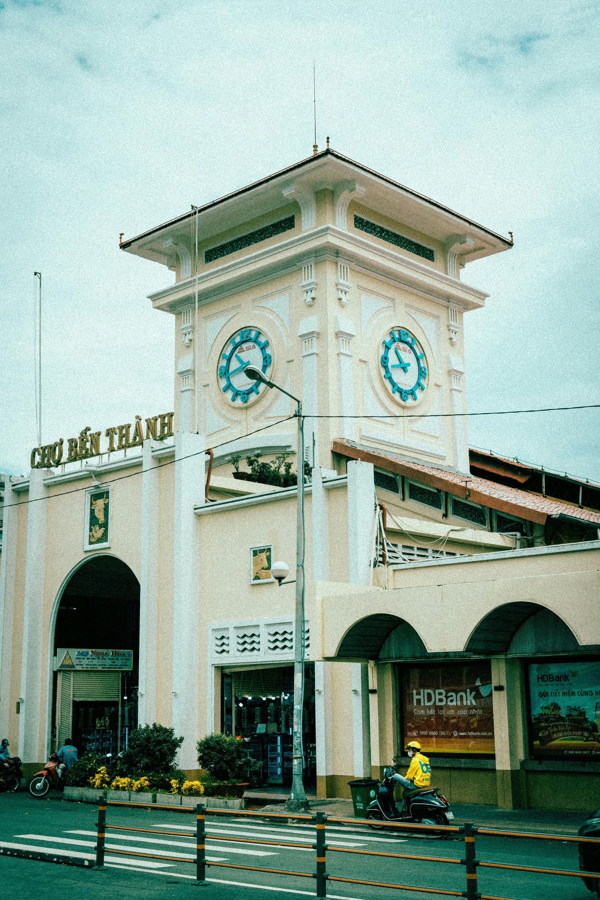 Ben Thanh Market in Ho Chi Minh City, featuring its iconic clock tower and bustling atmosphere.