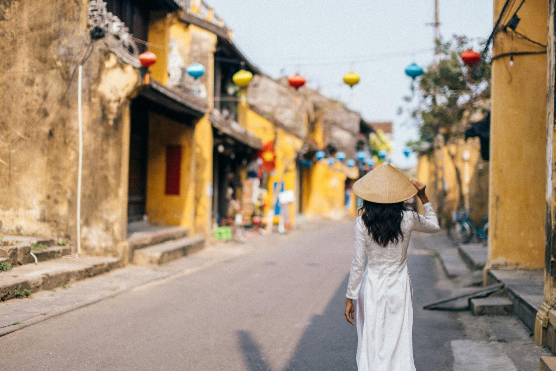 Colorful lanterns and ancient buildings lining the streets of Hoi An, Vietnam.