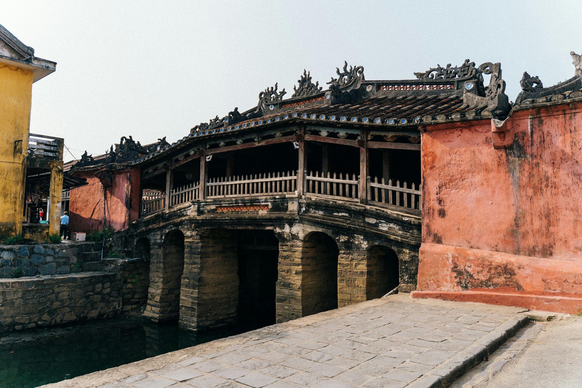 The Japanese Covered Bridge in Hoi An, Vietnam, illuminated at night.