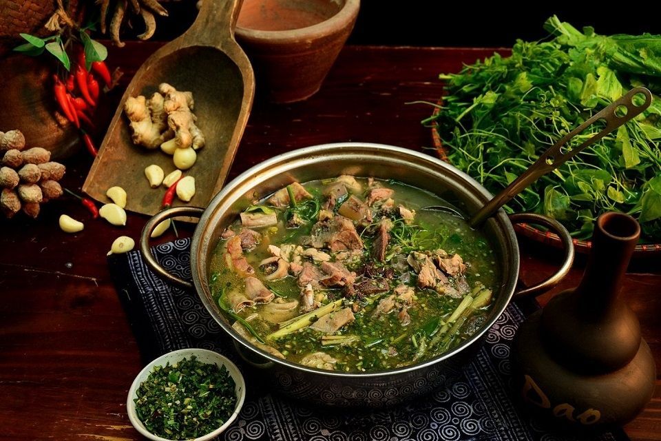 Thang Co, a traditional Vietnamese stew, on a dining table.