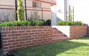 Brick retaining wall built by retaining wall builders in Riverside CA