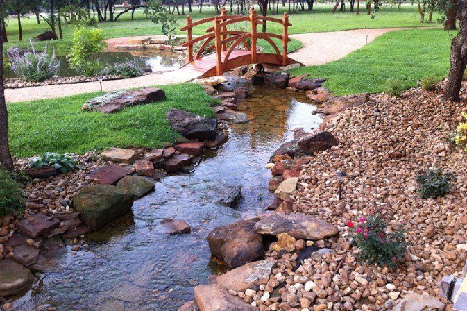 A small bridge over a stream in a park