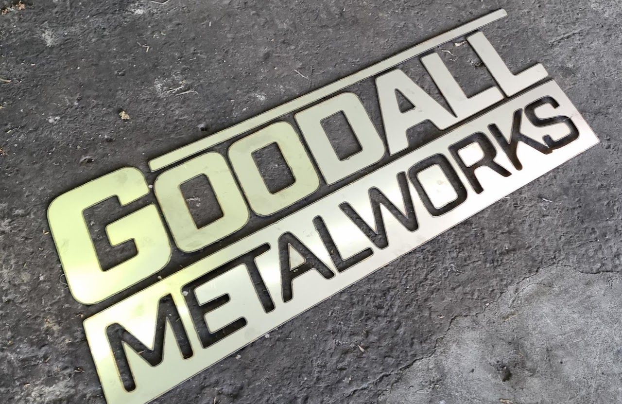 A sign that says goodall metalworks on it.