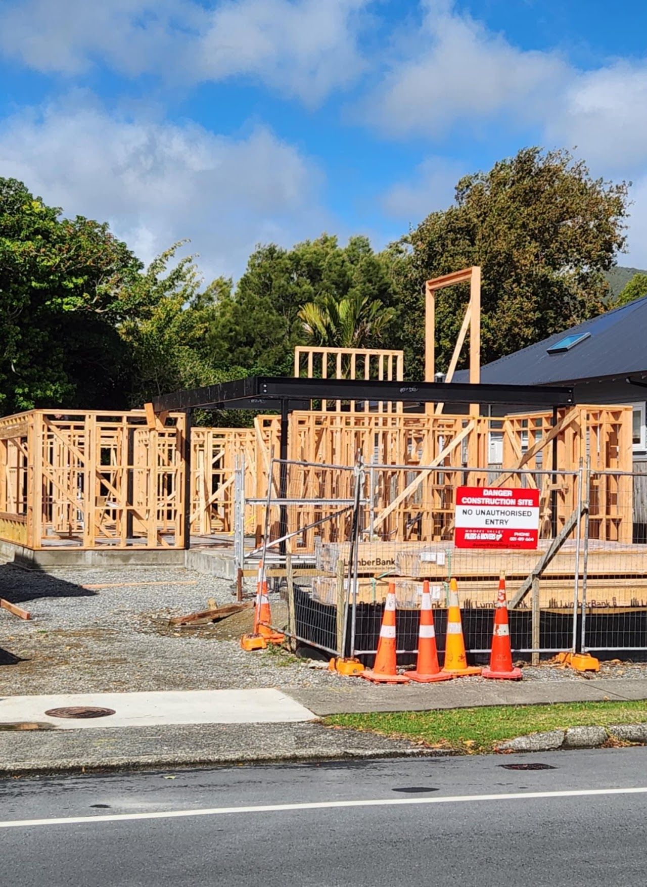 A house is being built on the side of the road.