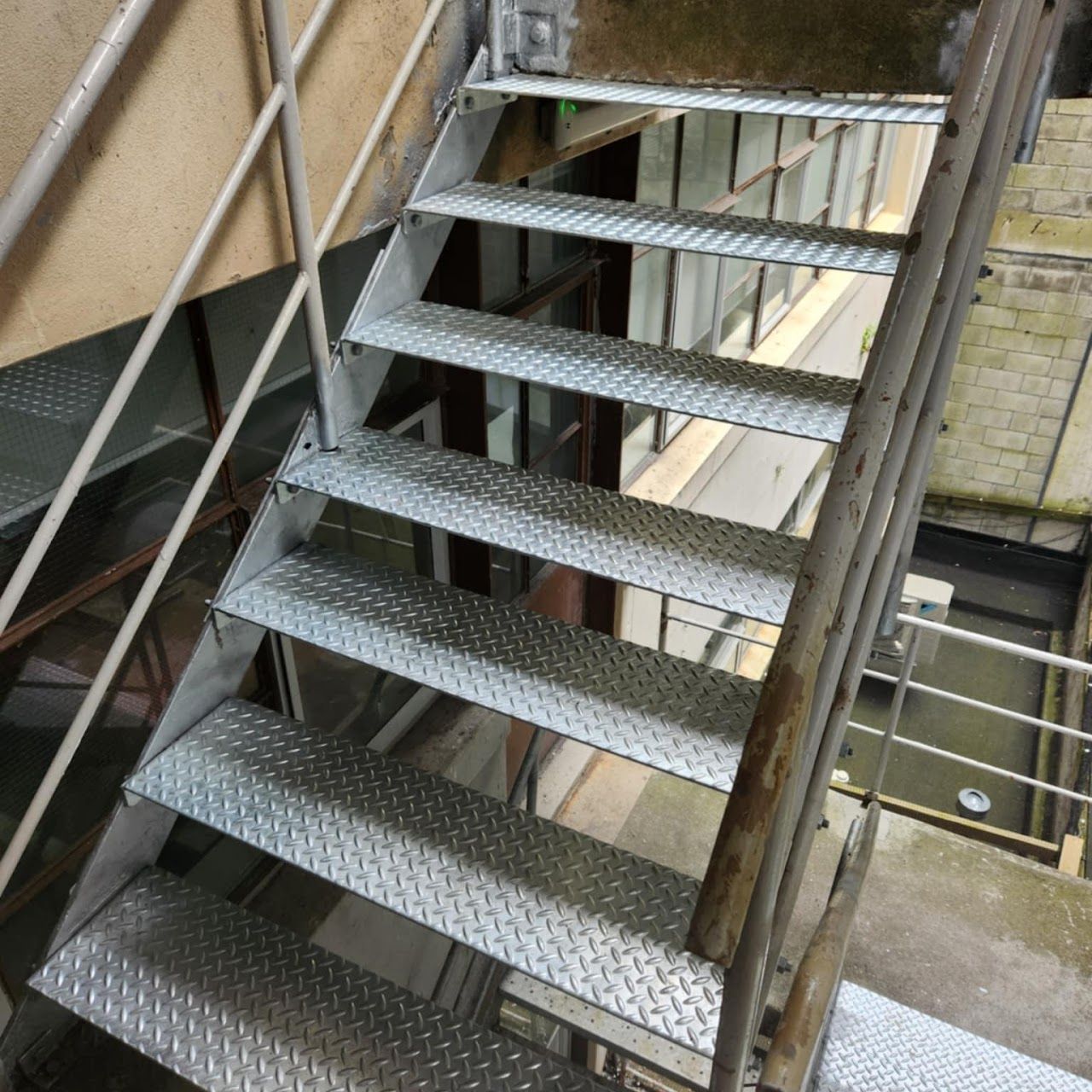 A set of metal stairs leading up to a building.
