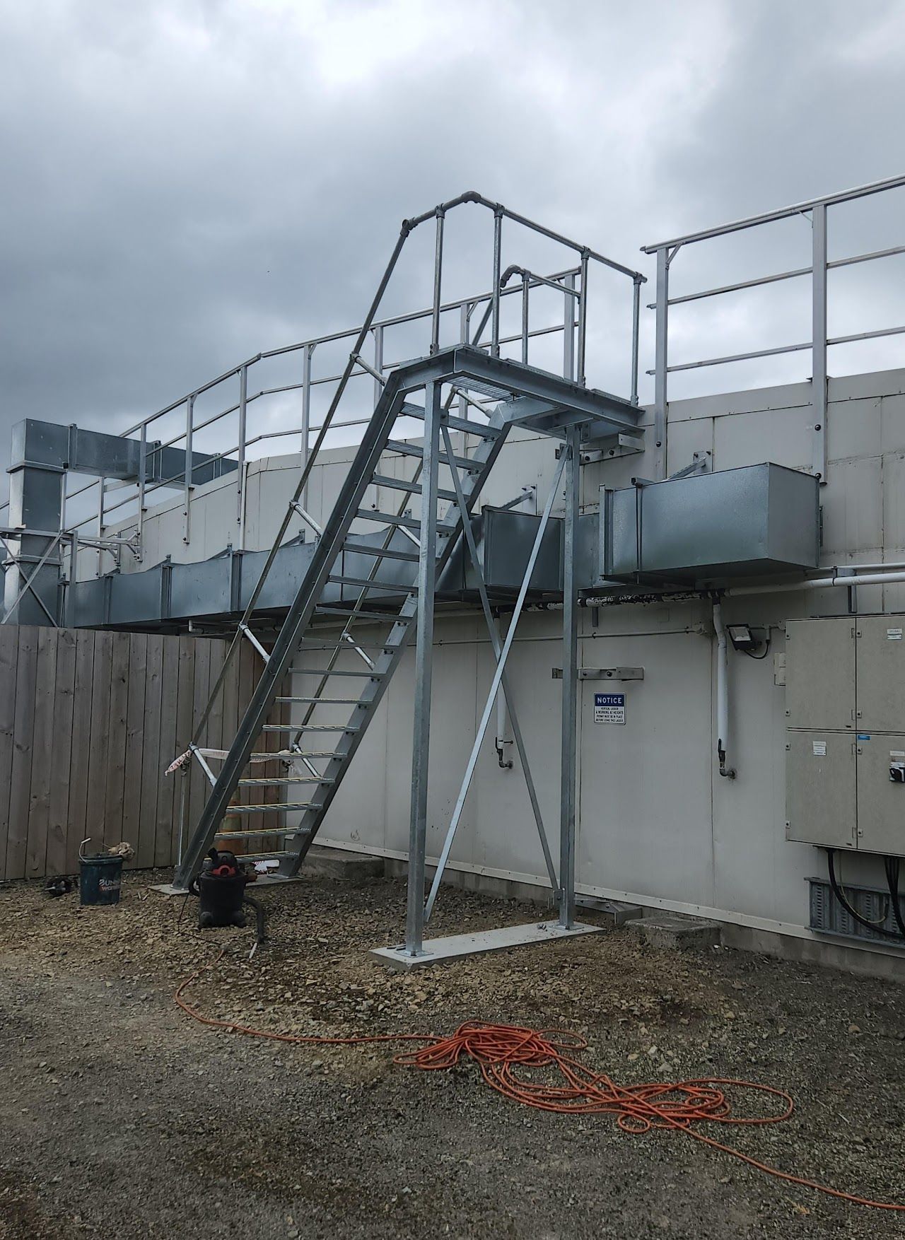 A metal staircase is attached to the side of a building.