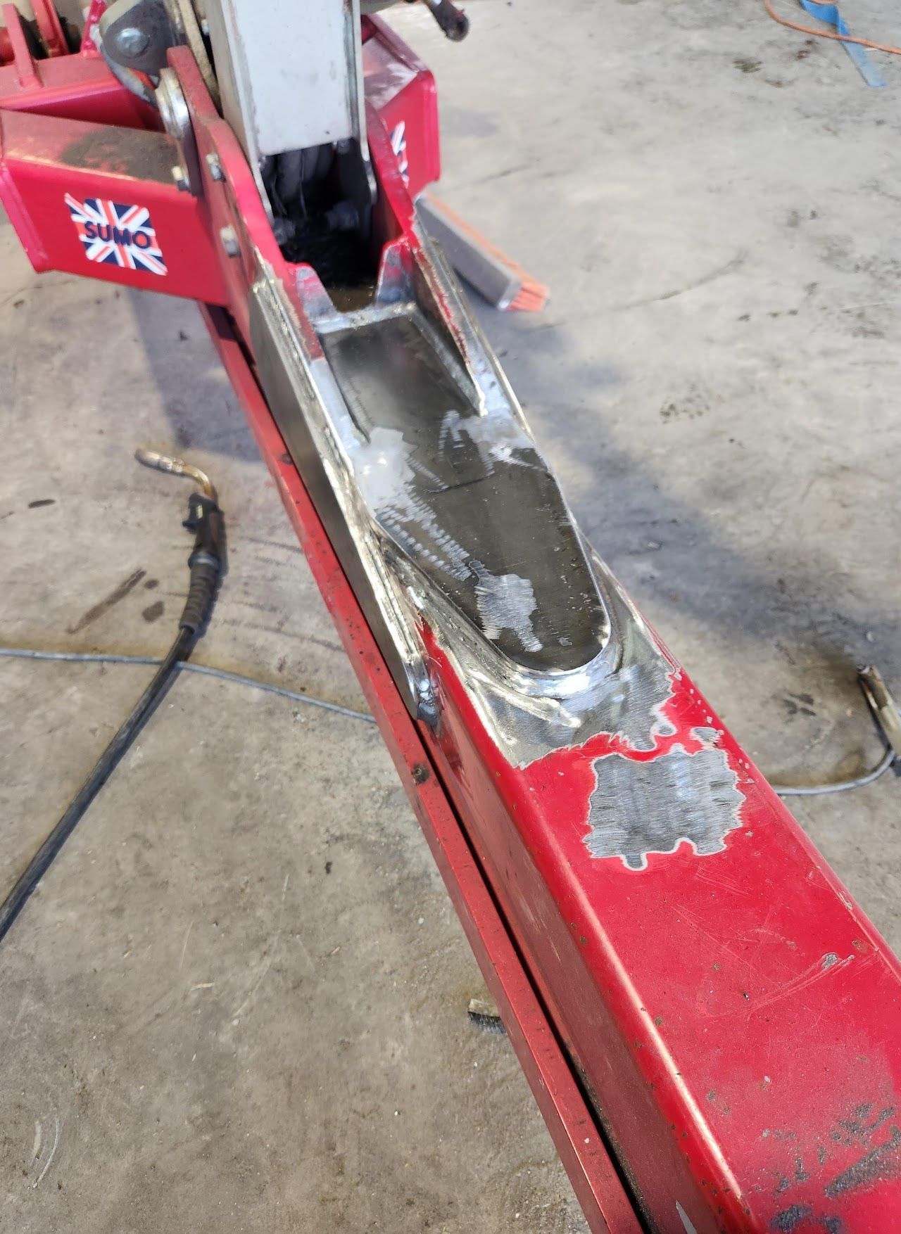 A red item with a sticker that says ' a ' on it