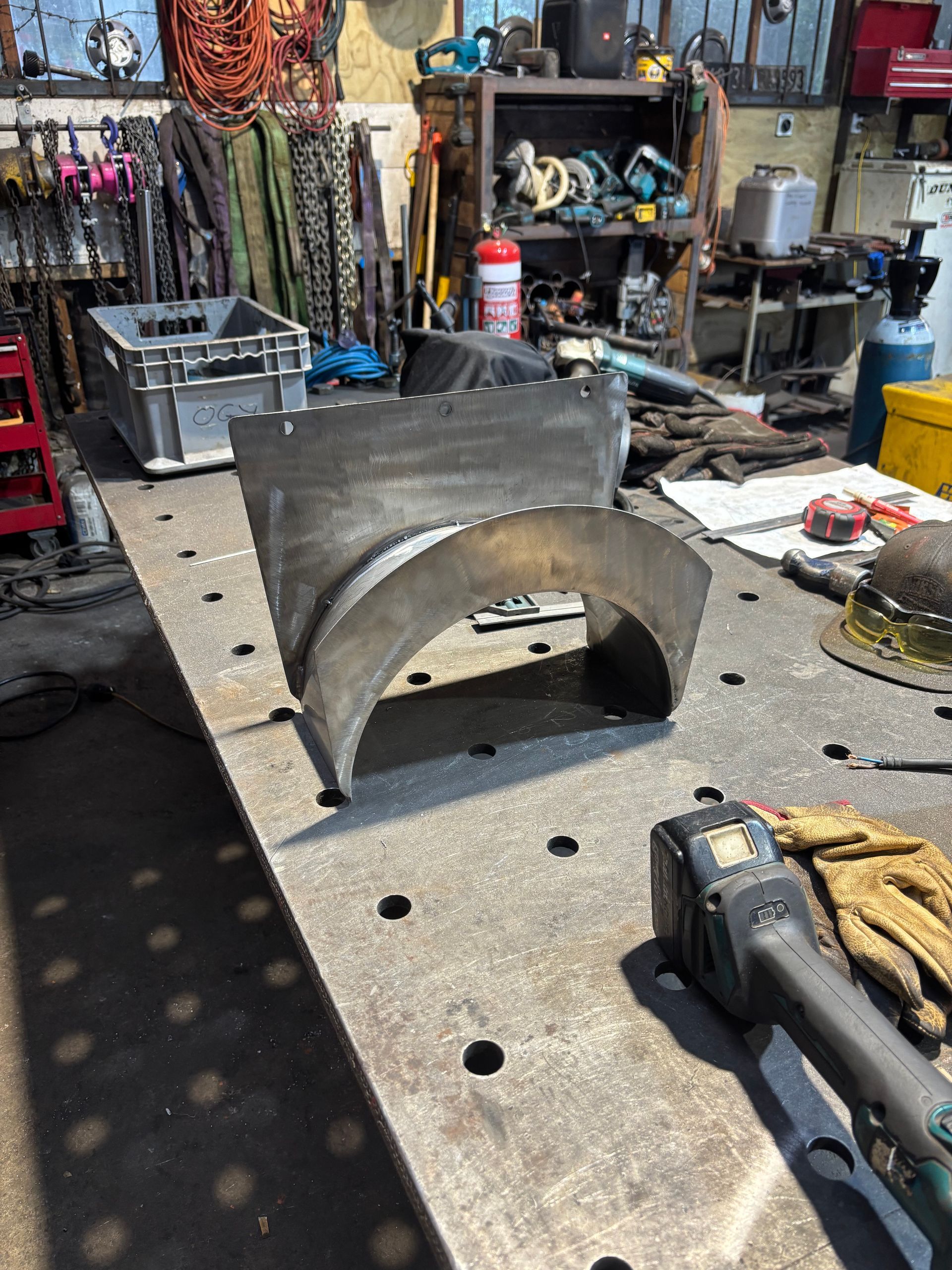 A wooden staircase in a room with a chair.