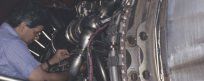 Man repairing industrial machinery
