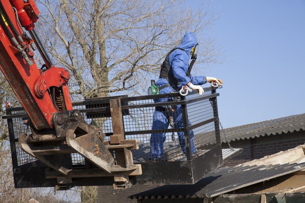 Worker Removing Asbestos — Asbestos Removal in Garbutt, QLD
