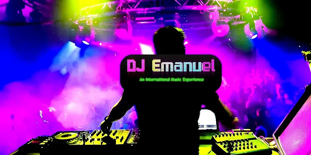 DJ Emanuel playing music at a club with colorful lights, behind the equipment. Musica Entertainment wedding DJ Long Island NY