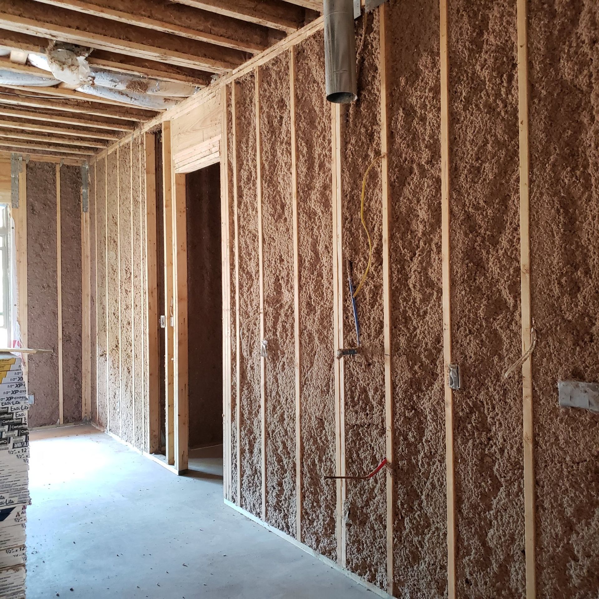 A hallway in a house that is being built