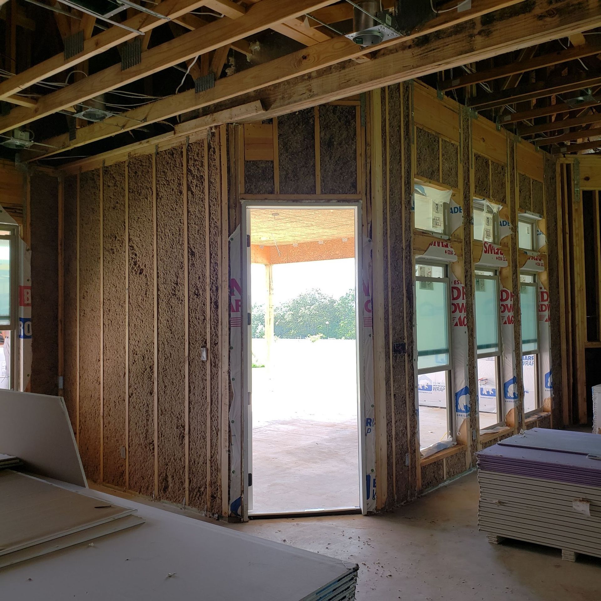 A room under construction with a door that is open