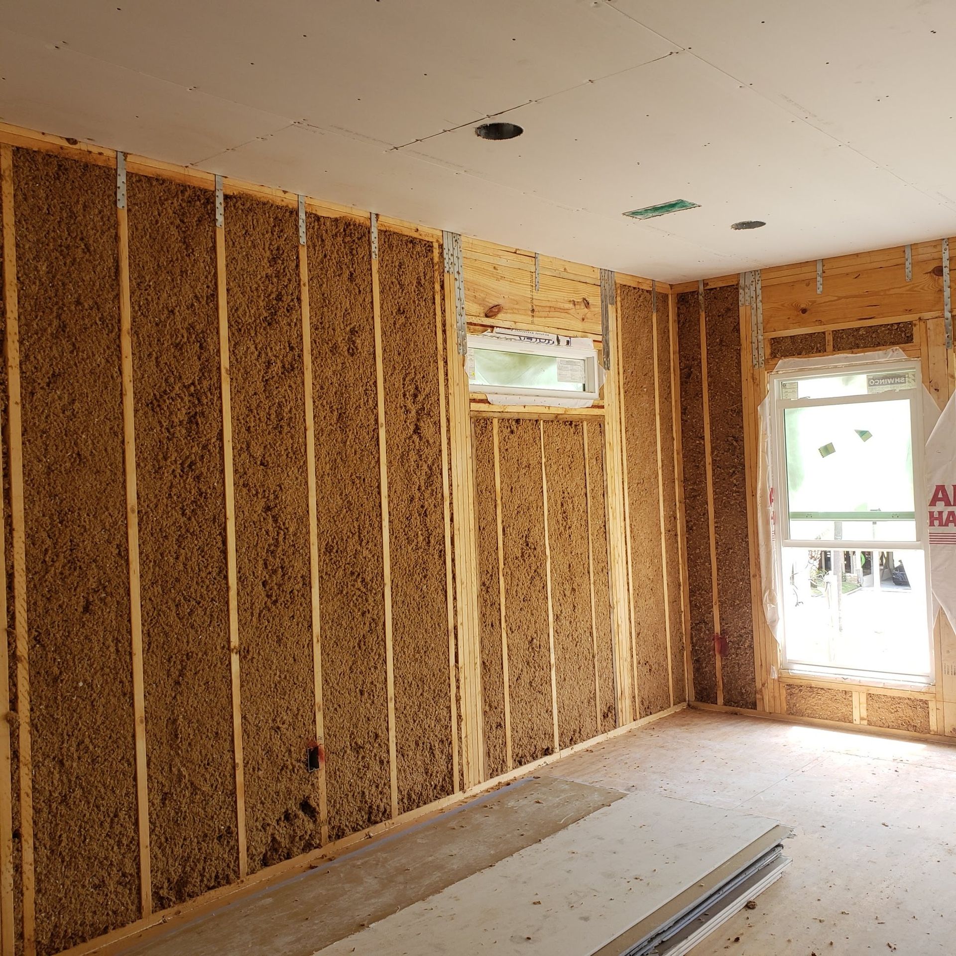 A room with a window and a bag that says ' a ' on it