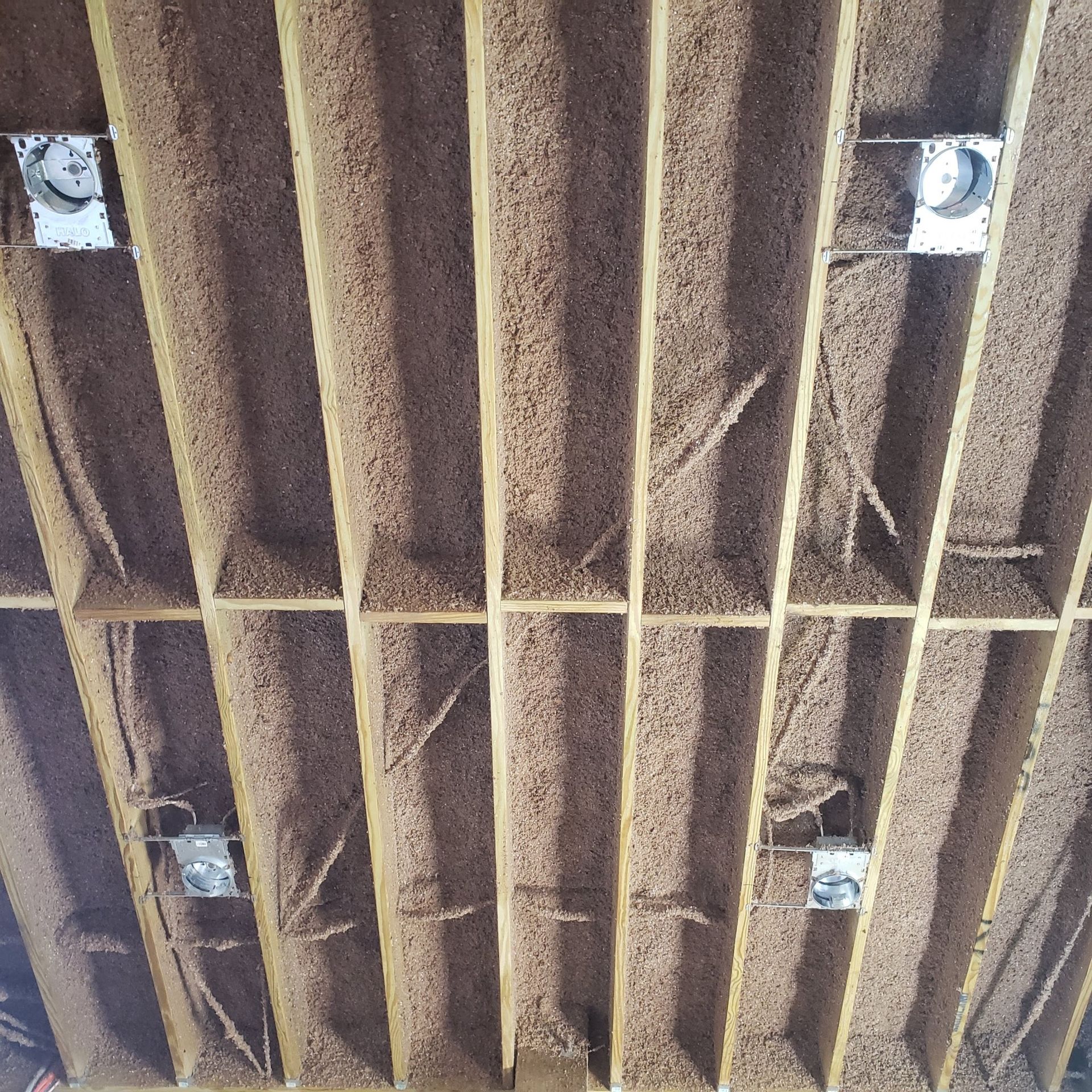 A ceiling with a lot of holes in it