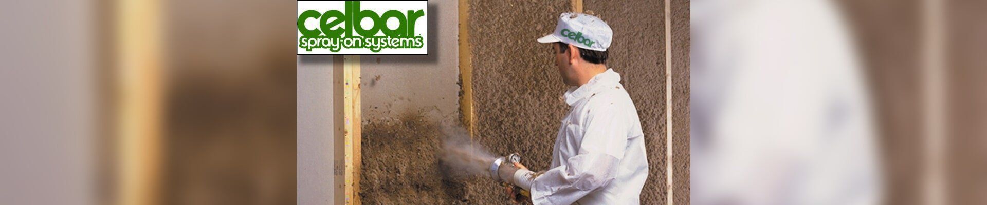A man is working on a wall with a celbor logo in the background