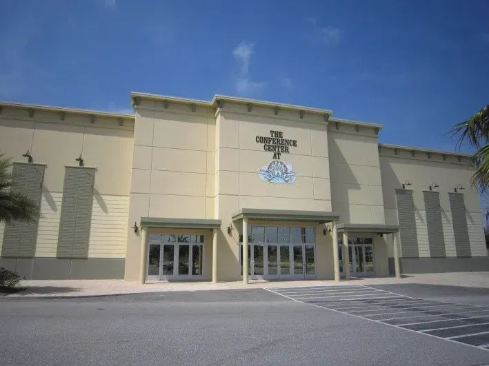 A large building with a cross on the front of it