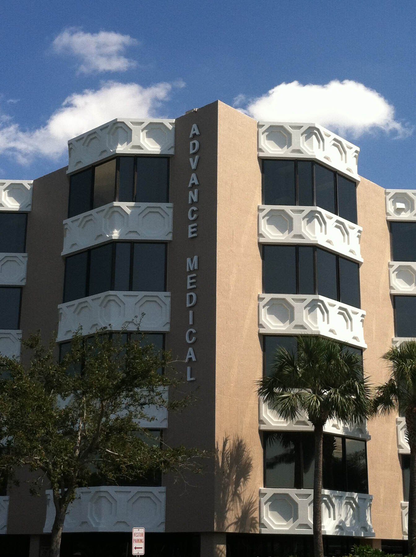 A large building with a sign that says advance medical