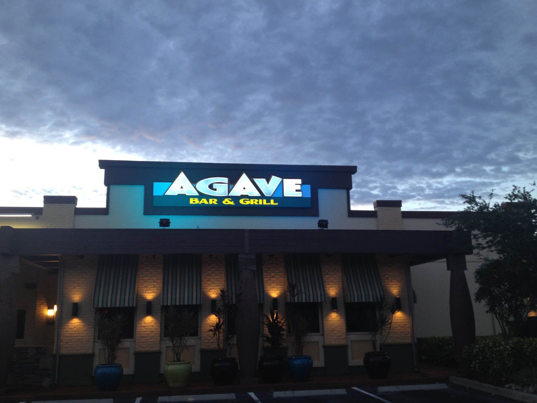 A building with a sign that says agave on it