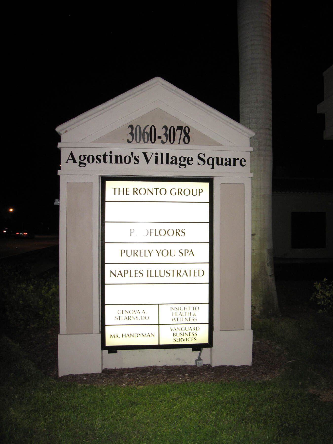 A sign that says ' agostino 's village square ' on it