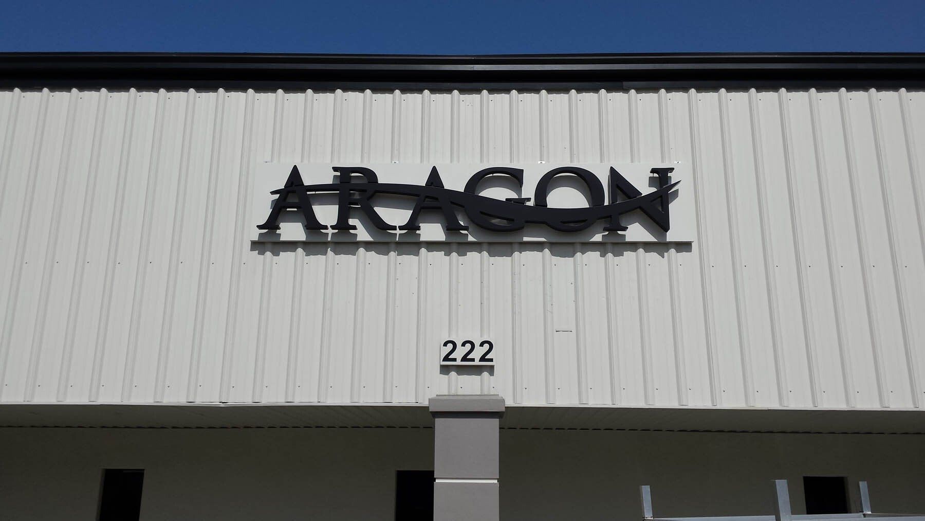 A white building with the word aragon on it