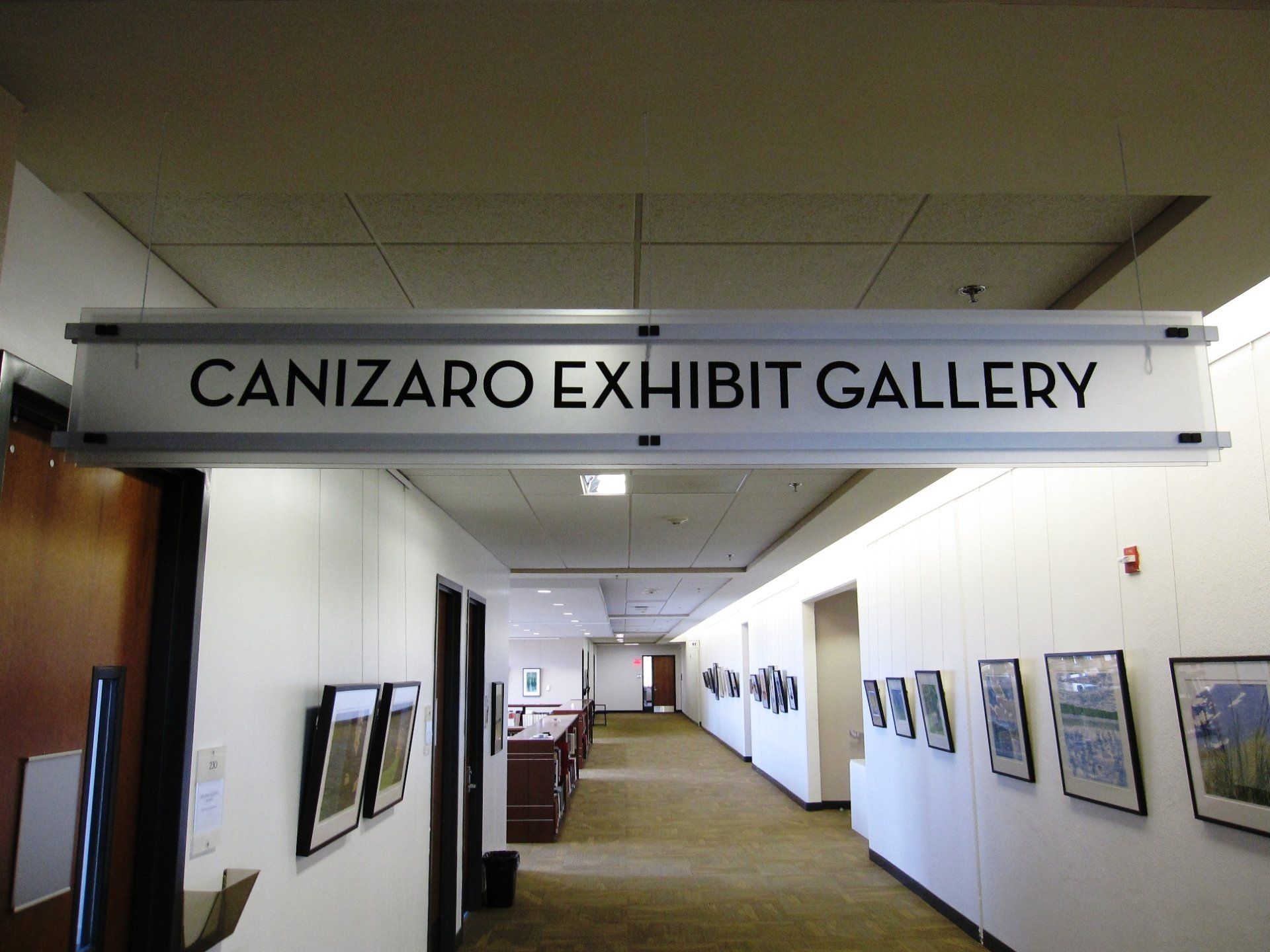 A long hallway leading to the canizaro exhibit gallery