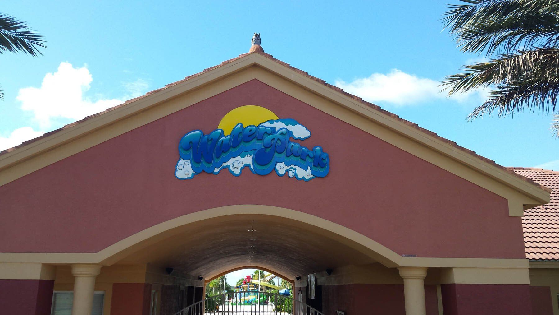 A building with a painting of waves and a sun on it